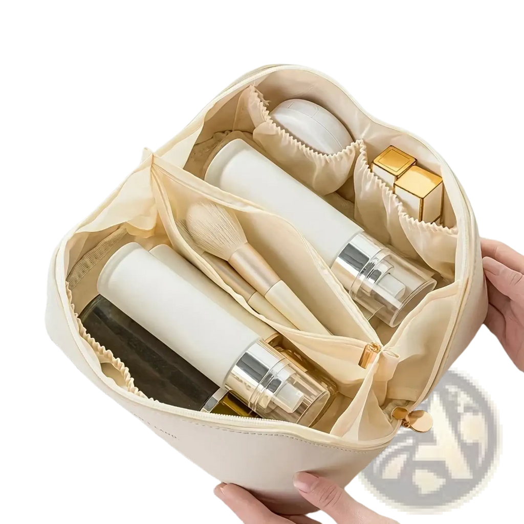 Beige waterproof fabric large travel makeup bag with internal compartments holding skincare and cosmetic items