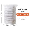 Large transparent plastic vacuum storage bag containing neatly stacked white quilts for clothes and quilts storage