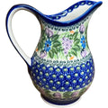 Handcrafted Polish pottery lavender ceramic pitcher with glossy finish and vibrant blue and green floral patterns