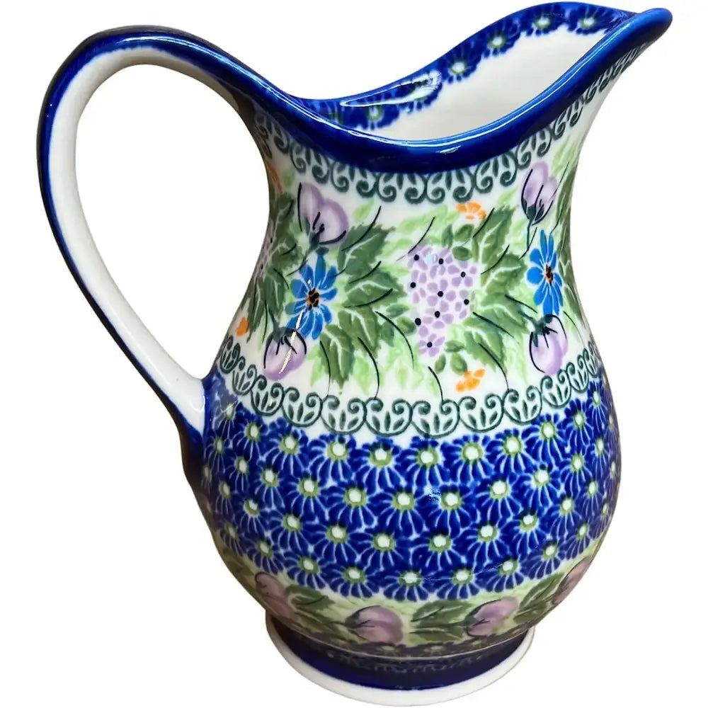 Handcrafted Polish pottery lavender ceramic pitcher with glossy finish and vibrant blue and green floral patterns