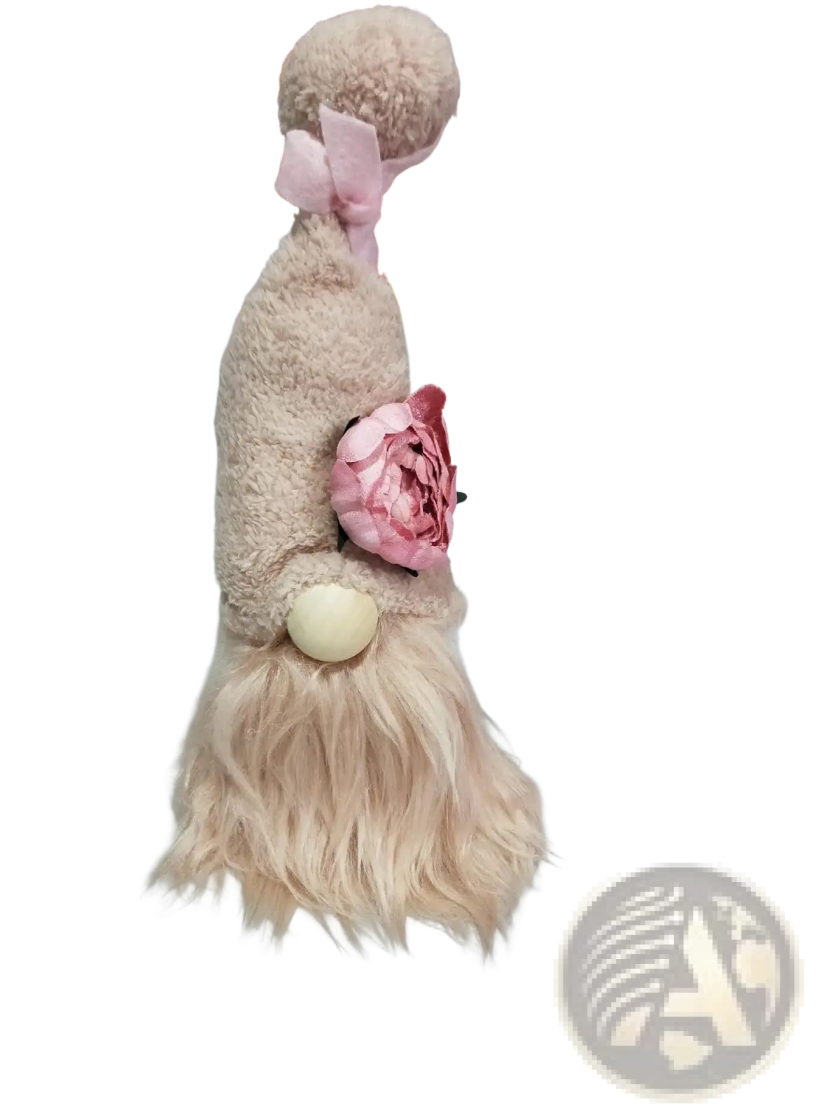 A plush beige lavender and pink gnome doll with a fluffy beard and pink bow as a desktop ornament
