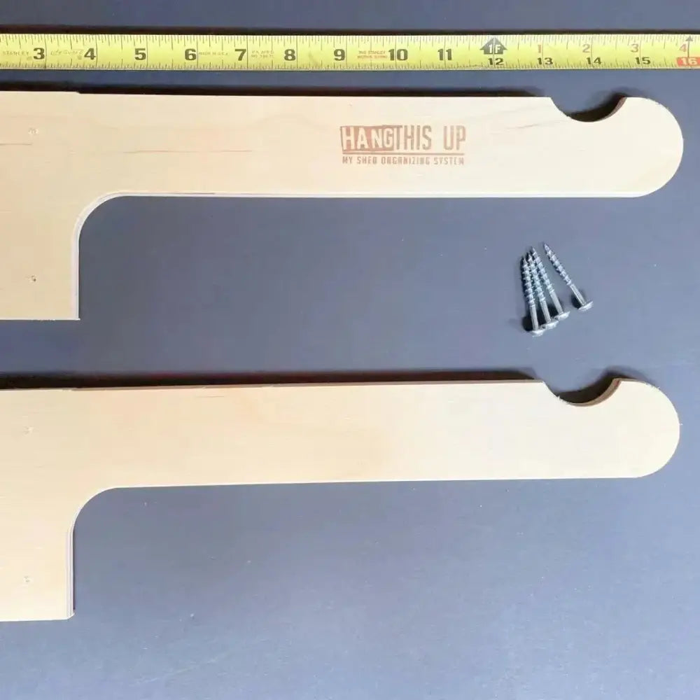 Light-colored wooden shelf organizer with curved handle and engraved branding for stud mounted steel lawn chair storage hooks