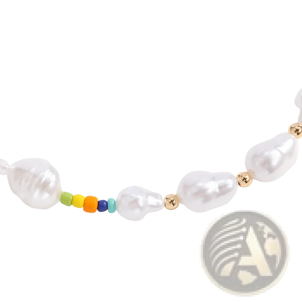 A layered gold butterfly and pearl necklace with irregular white pearls, gold beads, and a vibrant rainbow bead cluster