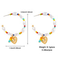 Gold heart-shaped pendant earrings with white pearl and colorful accent beads from layered gold butterfly and pearl set for women