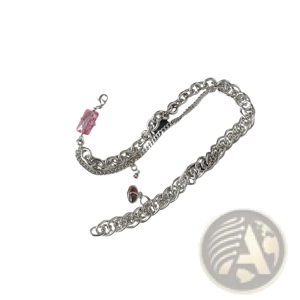 Silver chain belt with pink and red crystal charms complementing a layered silver opal and zircon crystal charm necklace