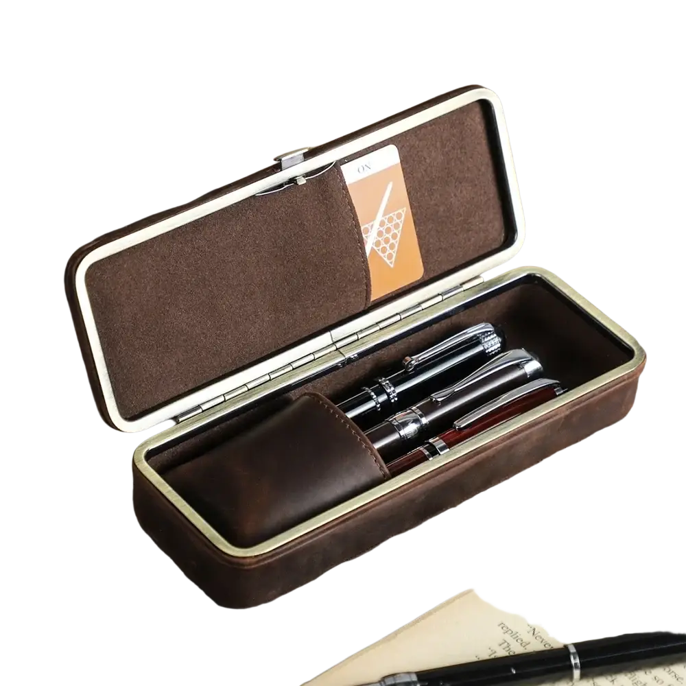 Brown leather 3 slot pen case with silver trim holding three fountain pens and a matching leather pouch