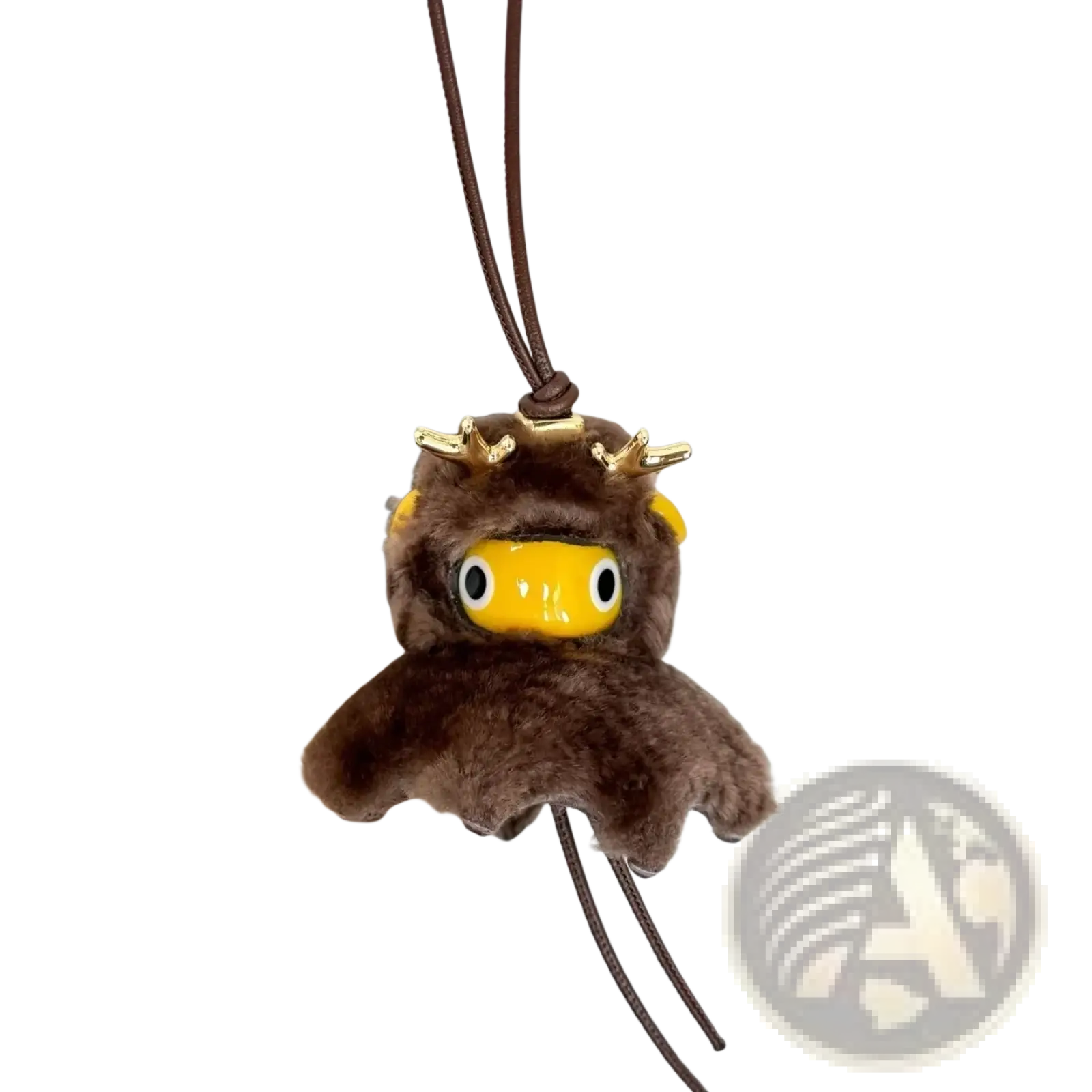 Brown leather plush reindeer keychain with gold antlers and yellow face as a cute designer bag charm accessory
