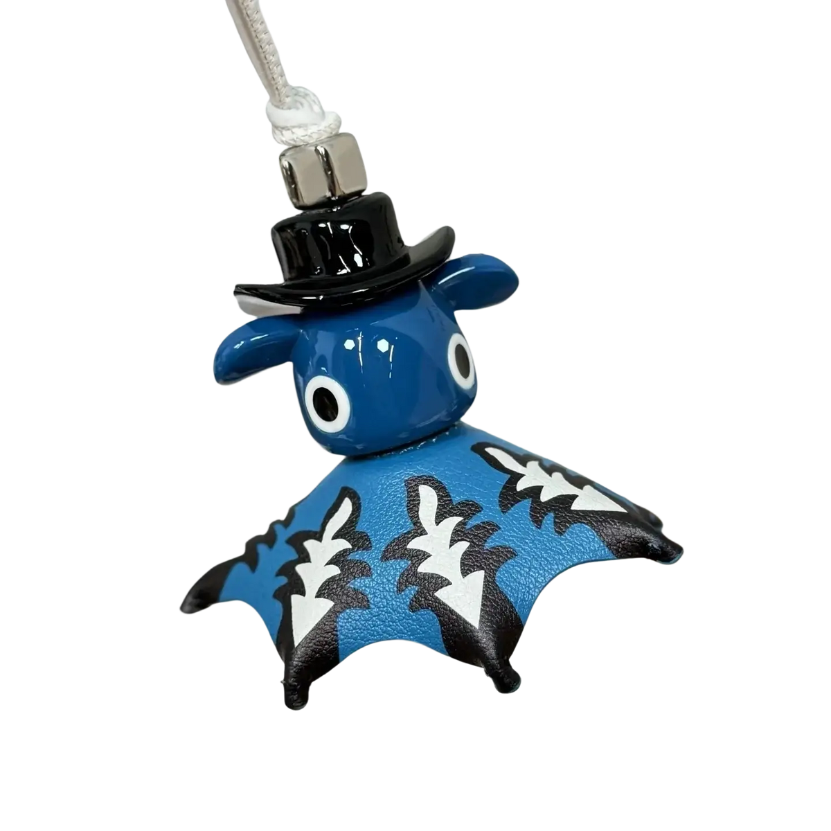 Leather animal bag charm cute designer keychain featuring a blue bat with black and white patterned wings and a glossy black top hat