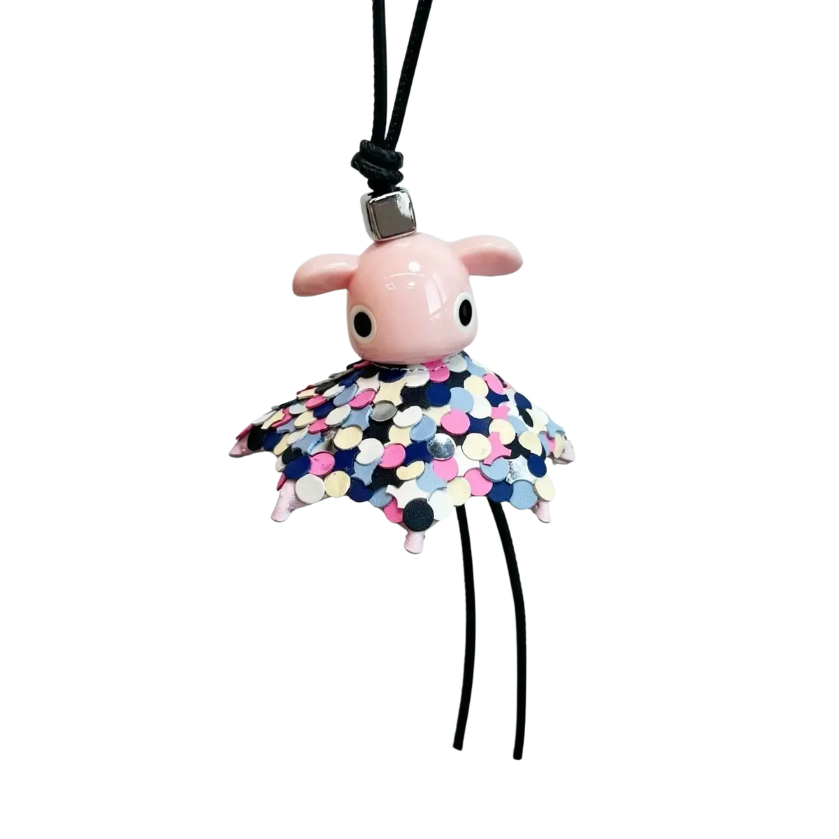 Leather animal bag charm featuring a pink ceramic pig figurine with a colorful sequined skirt and black cord