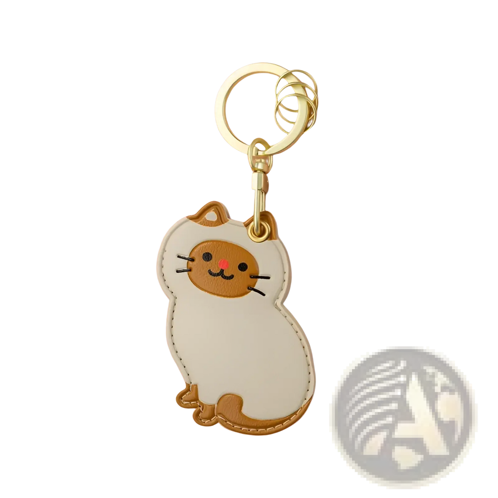 A cute cream and tan leather cat keychain with stitched details and a gold-tone metal ring bag charm