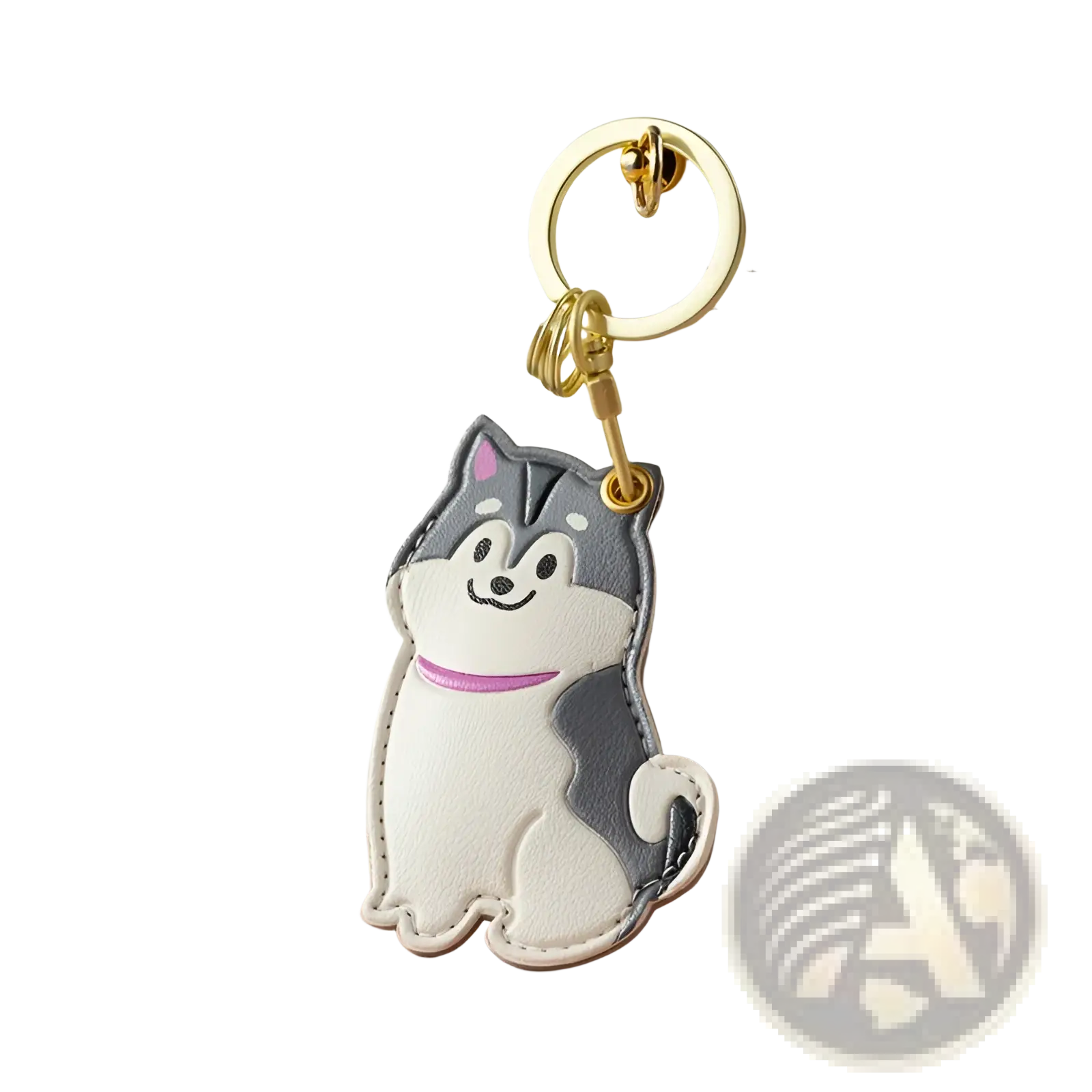 A white and gray husky-shaped leather keychain with pink collar attached to a gold metal ring for bag charm use