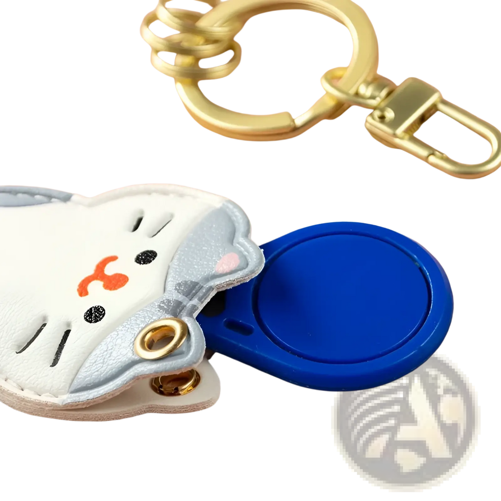 Leather animal keychain cute puppy cat bag charm featuring white and silver cat shape with orange nose and gold hardware