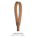 Adjustable textured leather handbag strap in biscuit color with silver-toned metal hardware and gold clasp