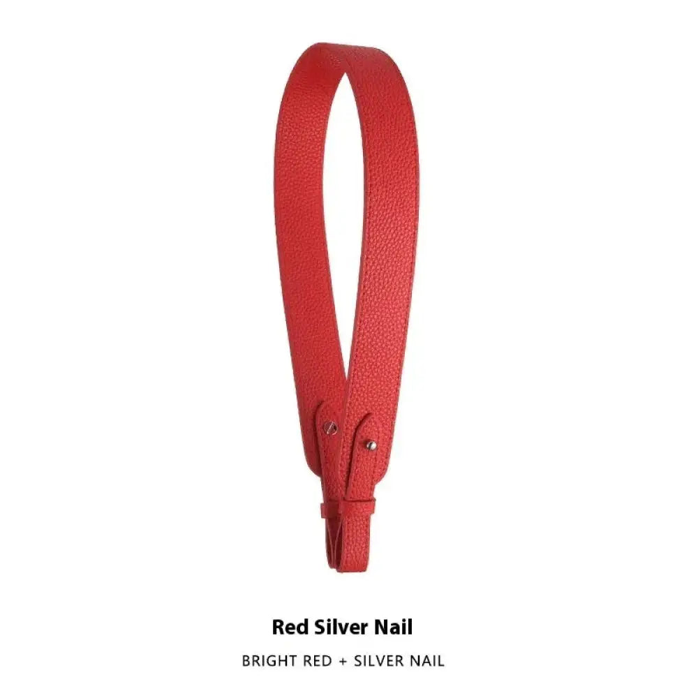 Adjustable textured leather handbag strap in bright red with silver nail accent and gold clasp for versatile styling