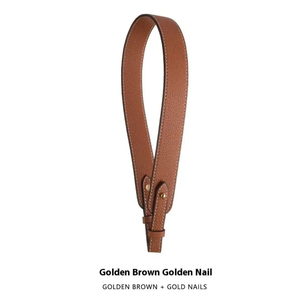 Adjustable textured leather handbag strap in golden brown with gold nail accents and gold clasp