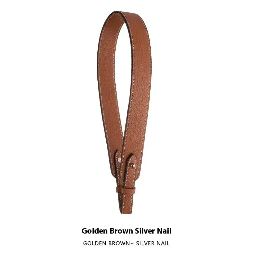Adjustable textured leather handbag strap in golden brown with silver nail hardware and gold clasp for versatile use