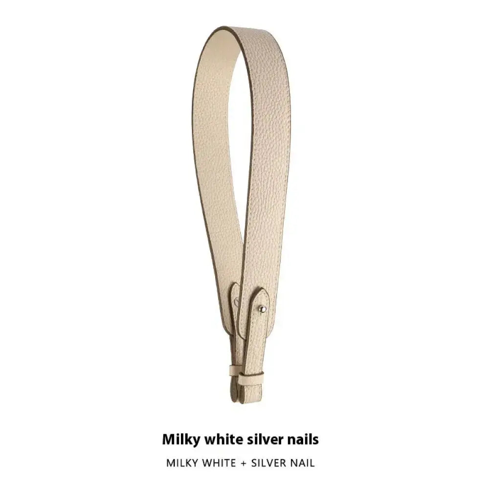 Milky white textured leather handbag hand strap with adjustable silver nail closure for secure carrying