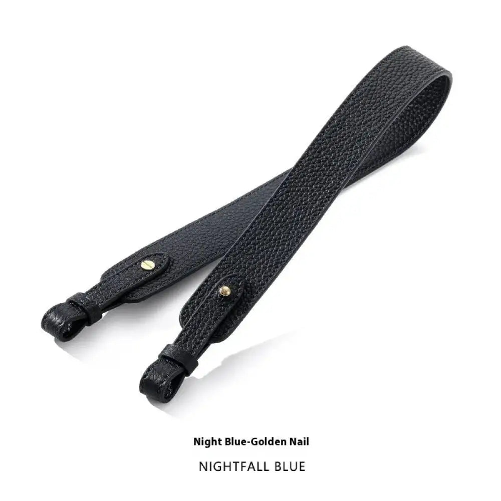 Adjustable textured leather handbag strap in black with gold-tone hardware for versatile shoulder use