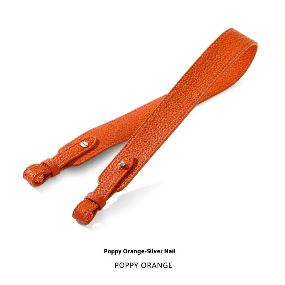 Adjustable textured leather handbag strap in poppy orange leather with silver nail hardware and gold clasp