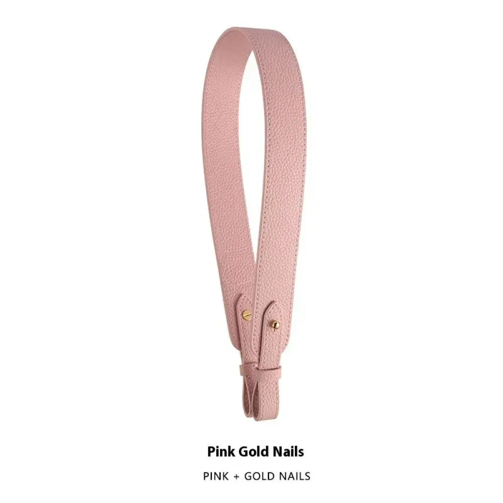 Adjustable textured pink leather handbag strap with gold-tone metal clasp and delicate textured surface
