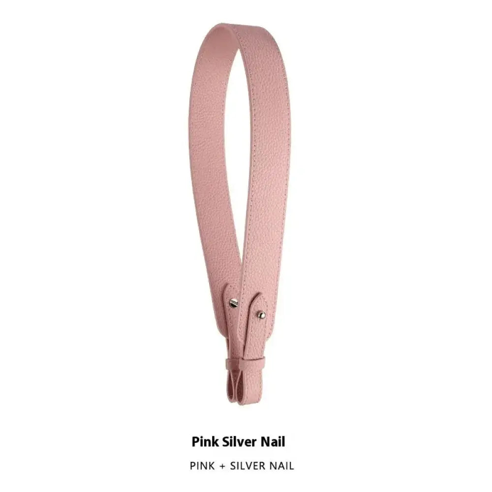 Adjustable textured pink leather handbag strap with silver nail accent and gold clasp for versatile use