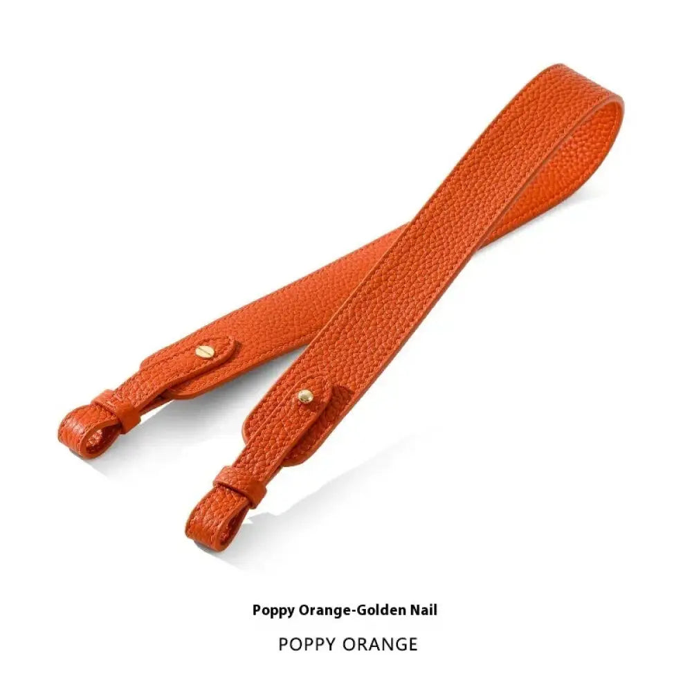 Adjustable textured leather handbag strap in poppy orange with gold nail hardware and gold clasp details