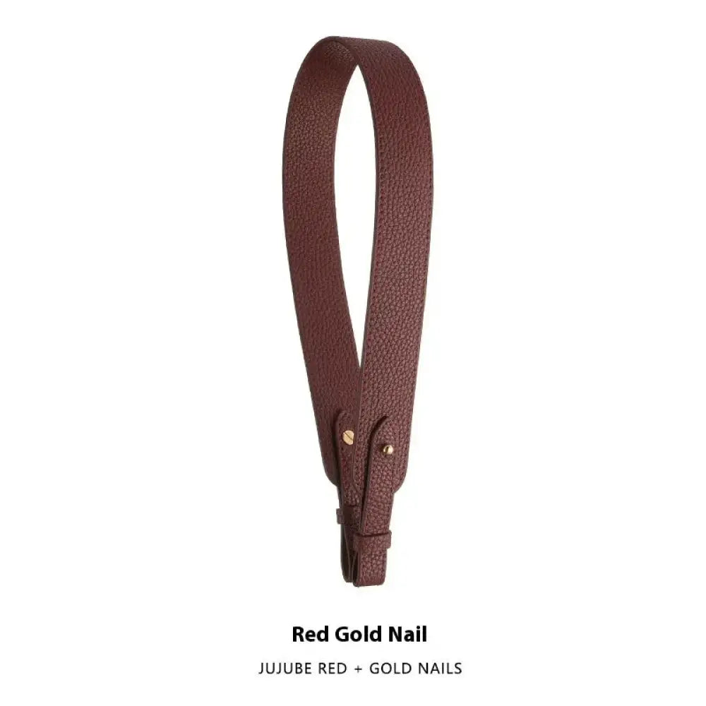 Adjustable textured leather handbag strap in brown with gold-tone hardware for versatile bag customization