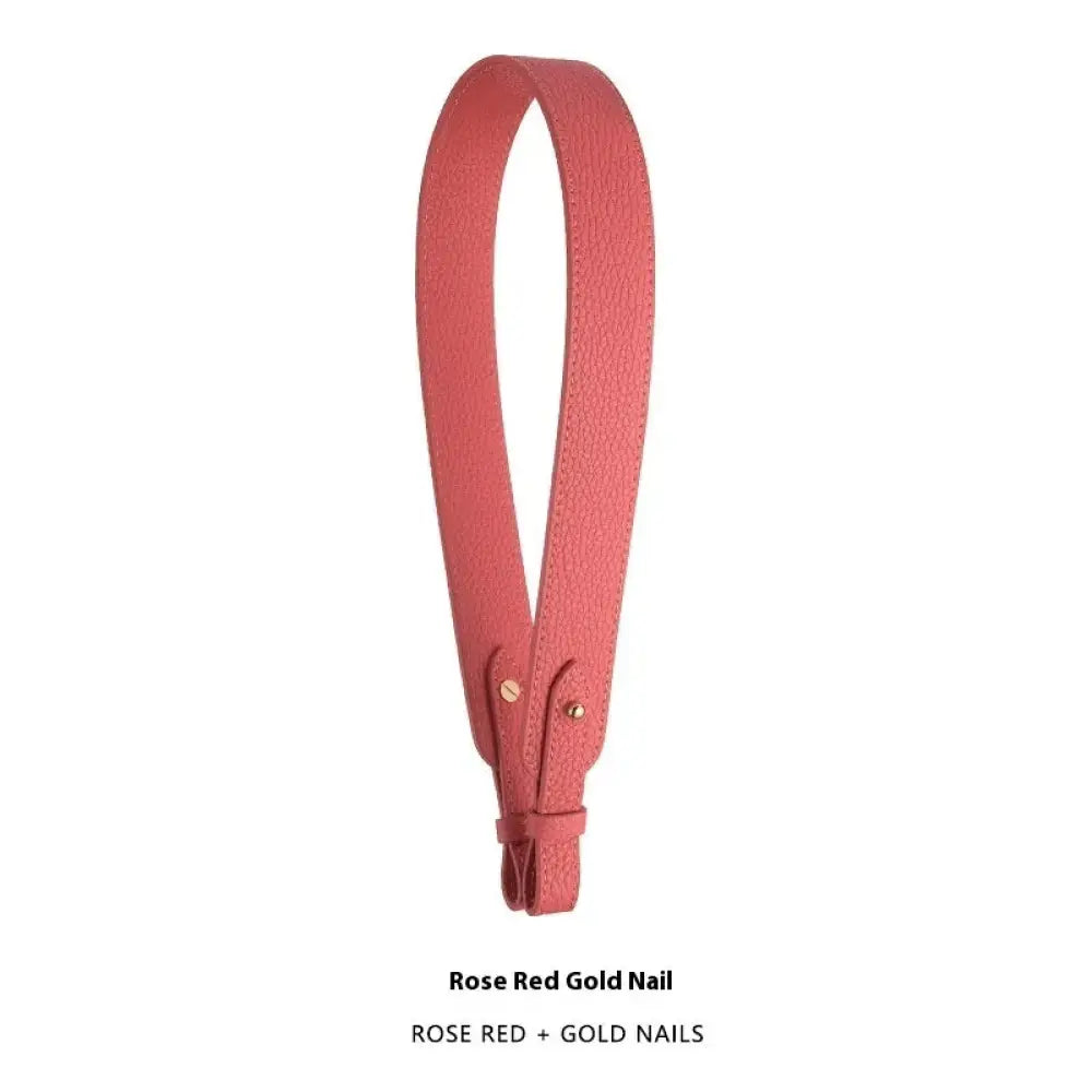 Adjustable rose red textured leather handbag strap with gold-tone hardware and clasp for secure attachment