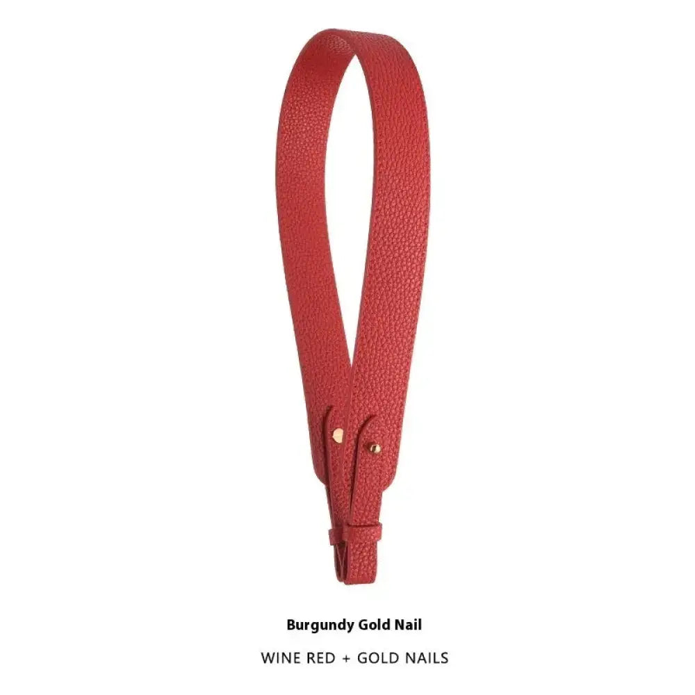 Wine red adjustable textured leather handbag strap with gold nail accents and gold clasp for stylish customization