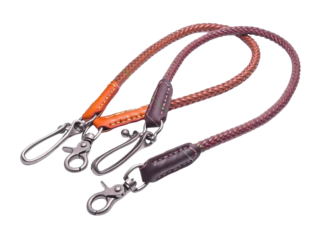 Two braided leather biker wallet chains in orange and dark brown with metal clasps and stitched ends for punk jeans