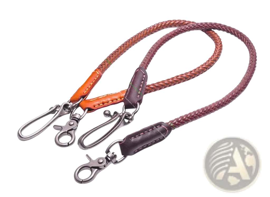 Two braided leather biker wallet chains in orange and dark brown with metal clasps and stitched ends for punk jeans