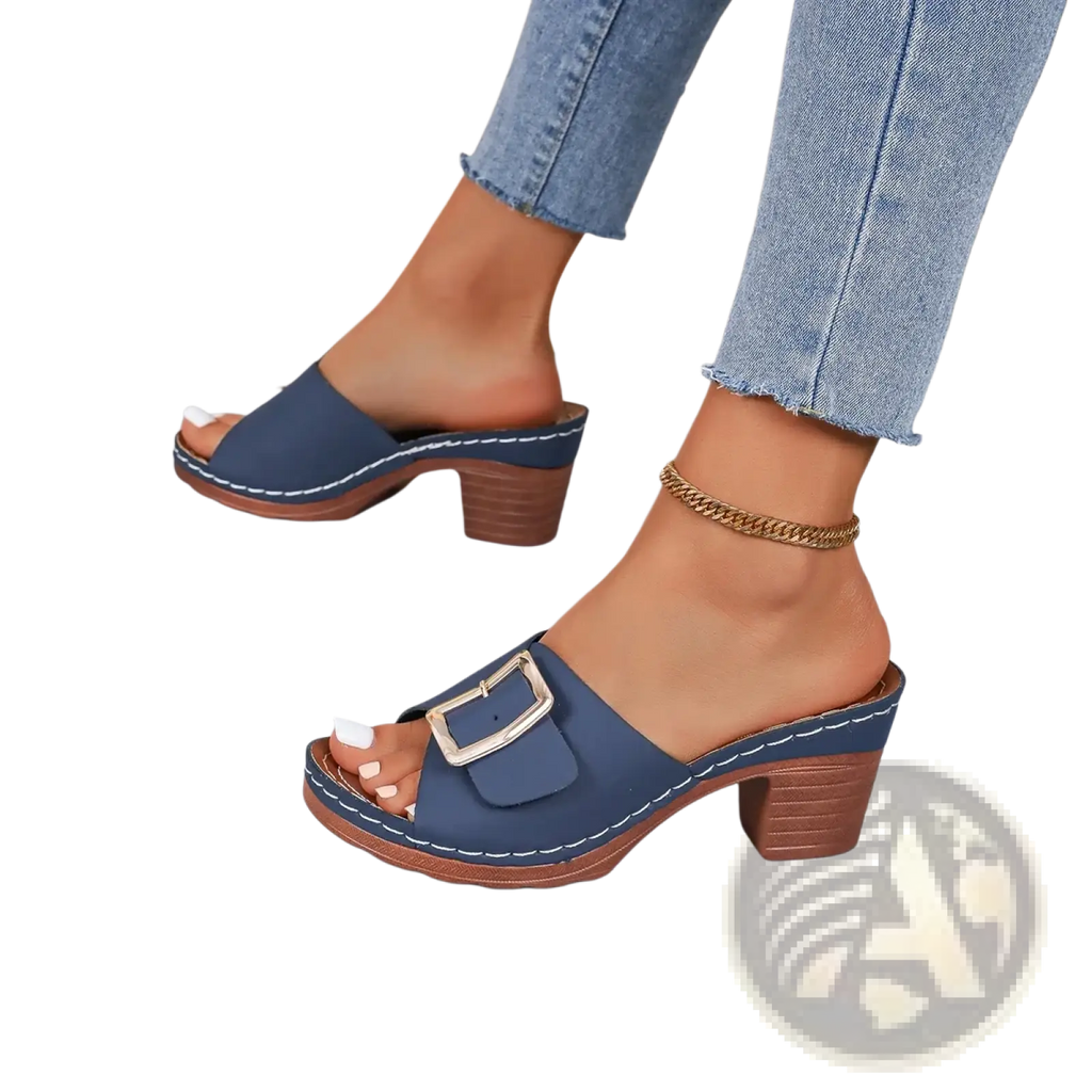 Navy blue leather block heel mule sandals with a silver buckle and wooden heel for stylish comfort