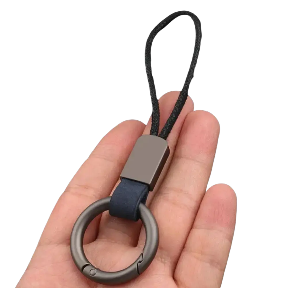 Dark gray metal leather braided carabiner keychain with navy blue leather strap and black braided cord detail