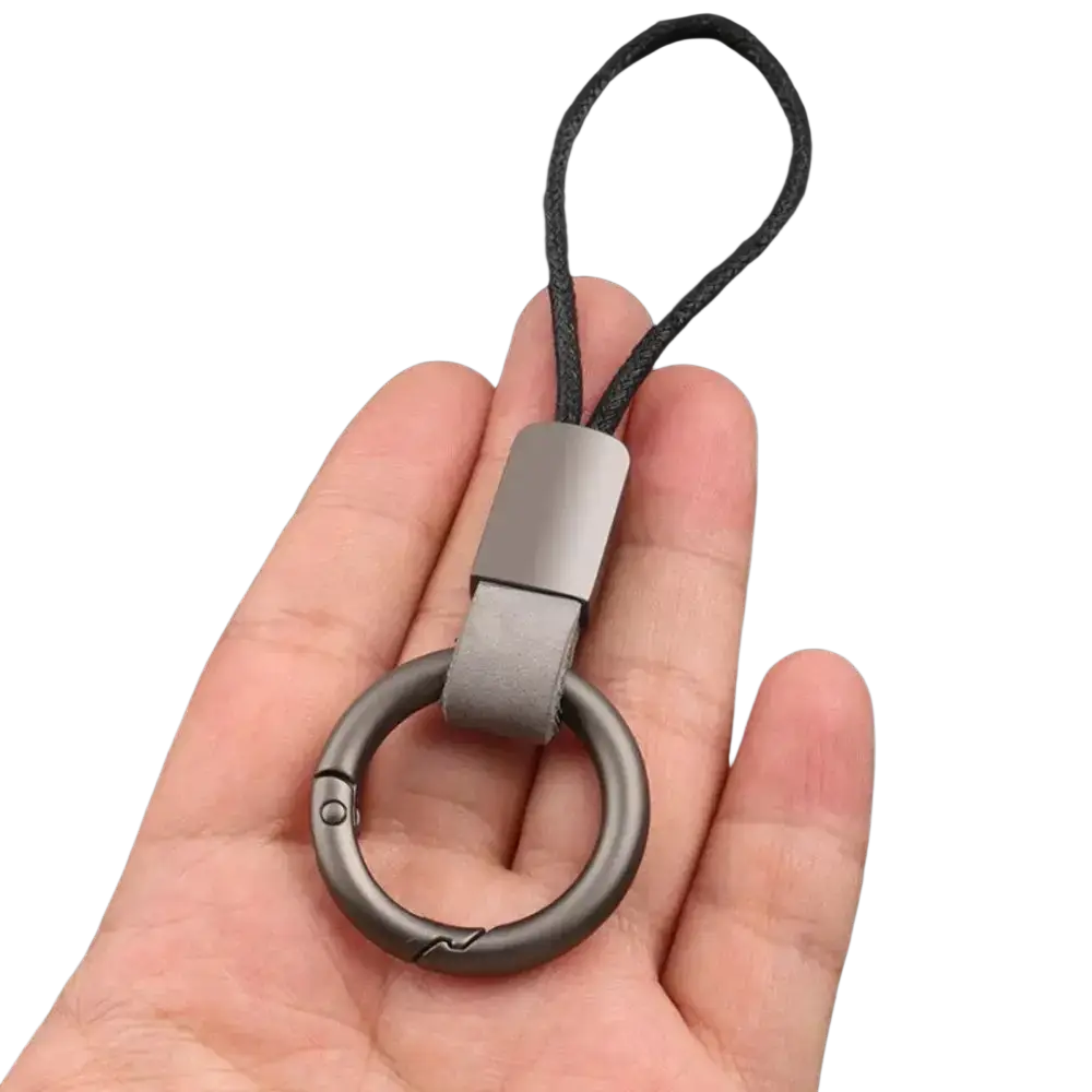 Gray metal leather braided carabiner keychain with a leather strap and black braided cord for secure key holding