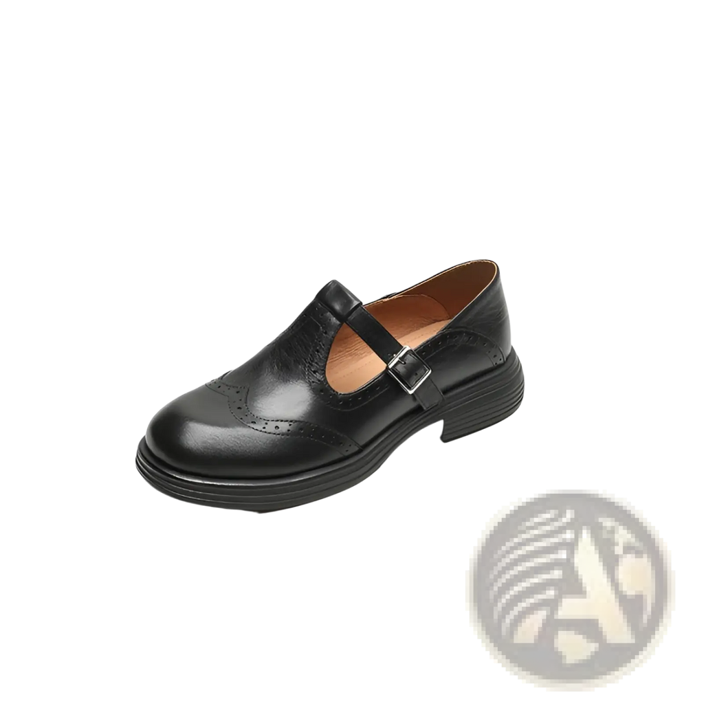 Black leather mary jane shoe with brogue detailing and a buckle strap for women in brown and black options