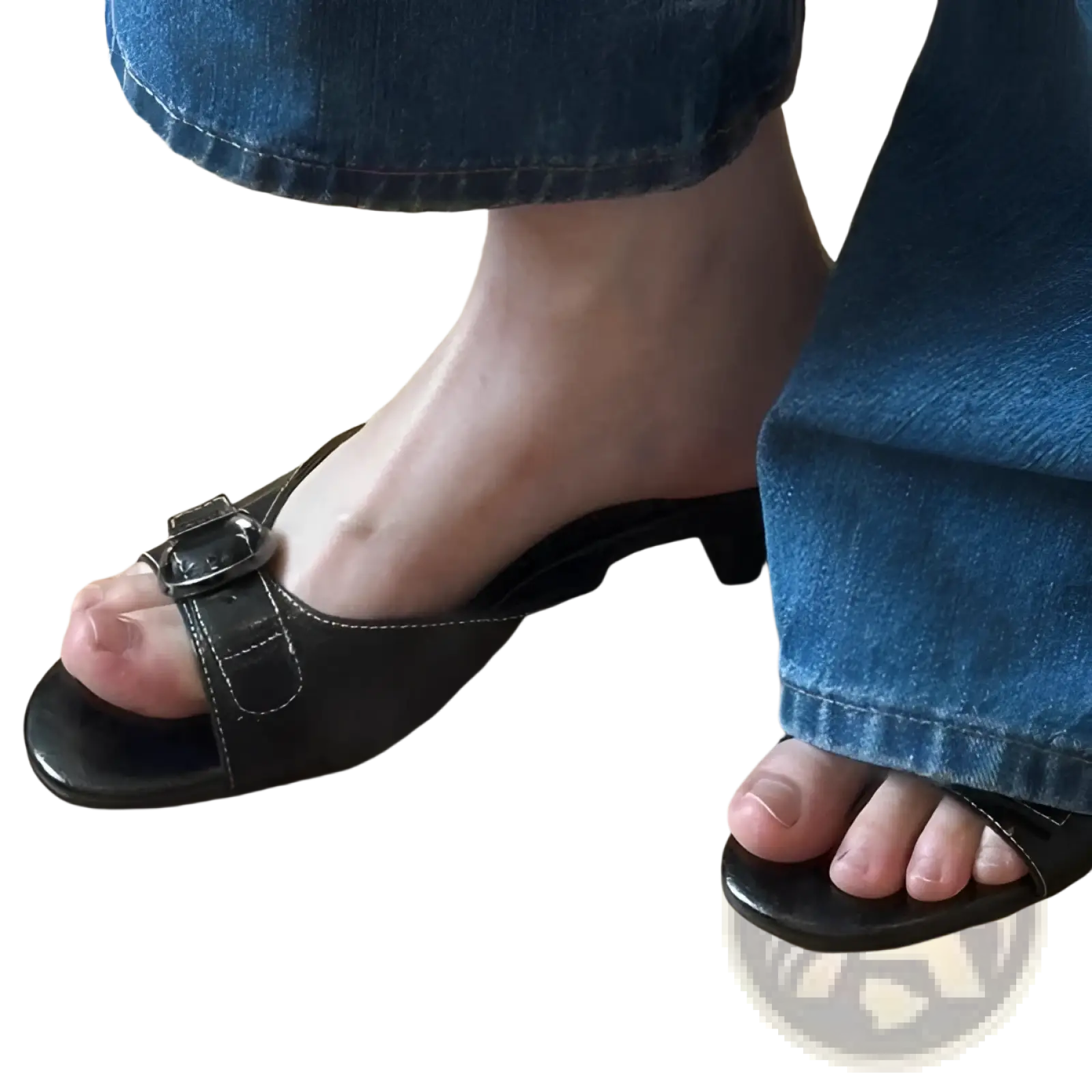 Black leather mule sandals for women with a square toe buckle strap and low heel shown from the back side