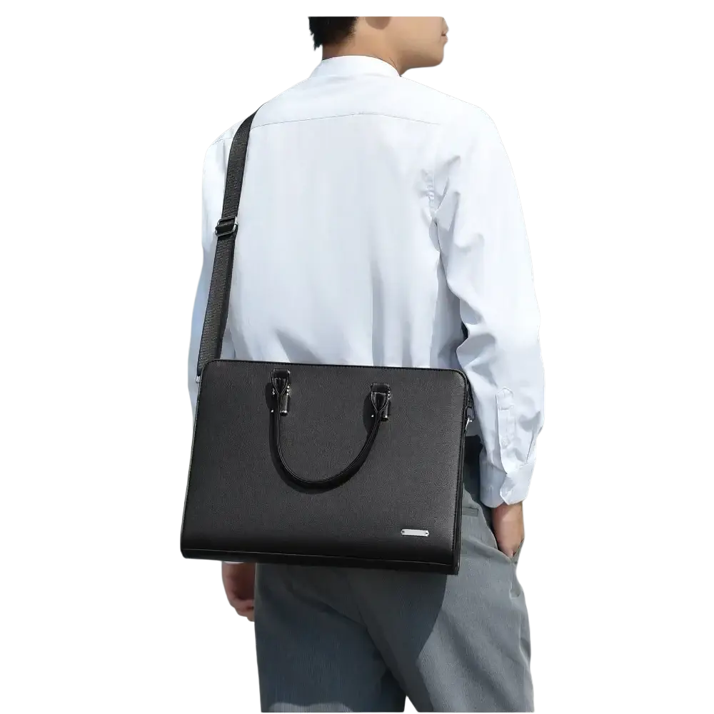 Black leather business laptop briefcase for men with textured surface and silver-toned hardware
