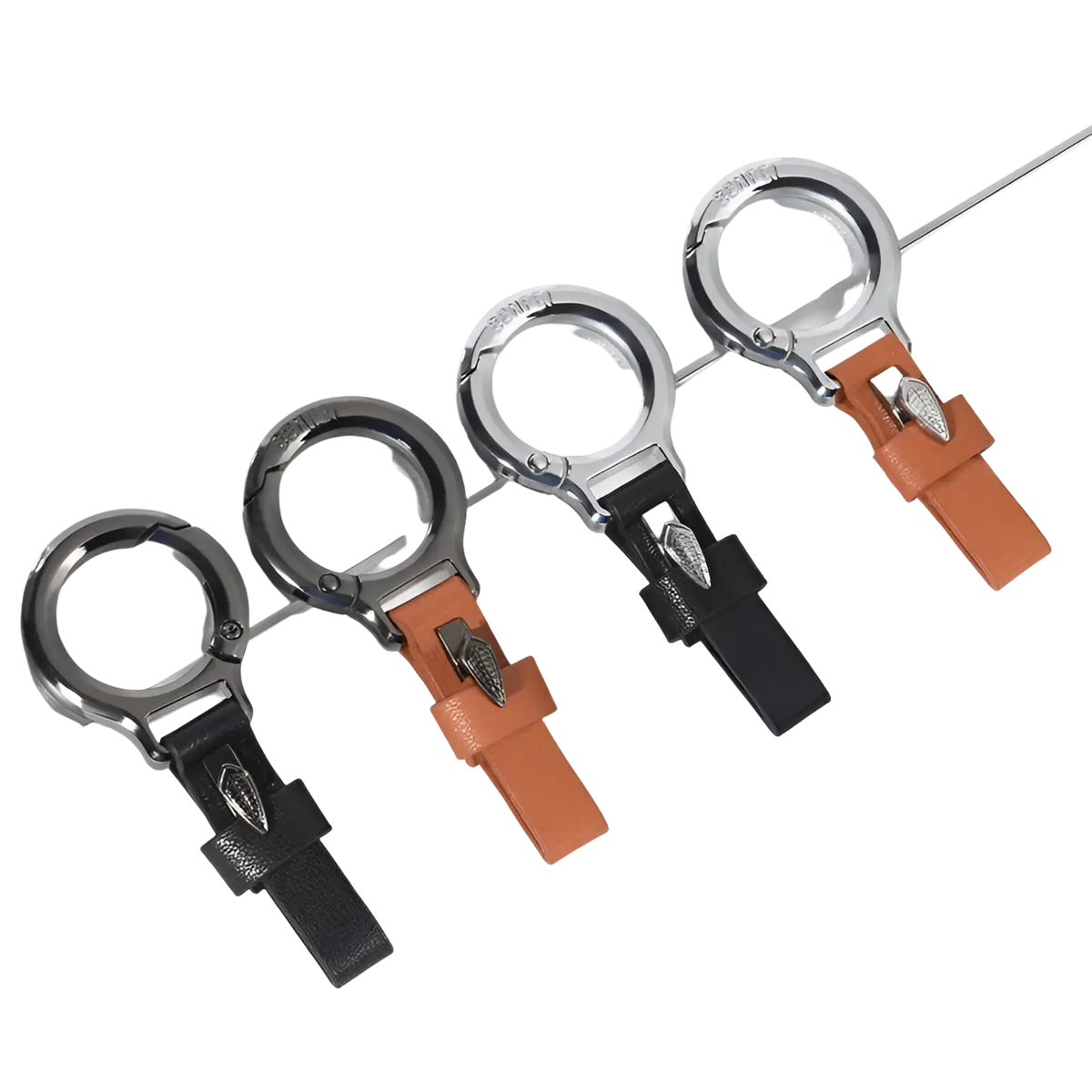 Leather car keychain with black or orange leather strap, silver buckle, and sleek metallic ring featuring leaf charm