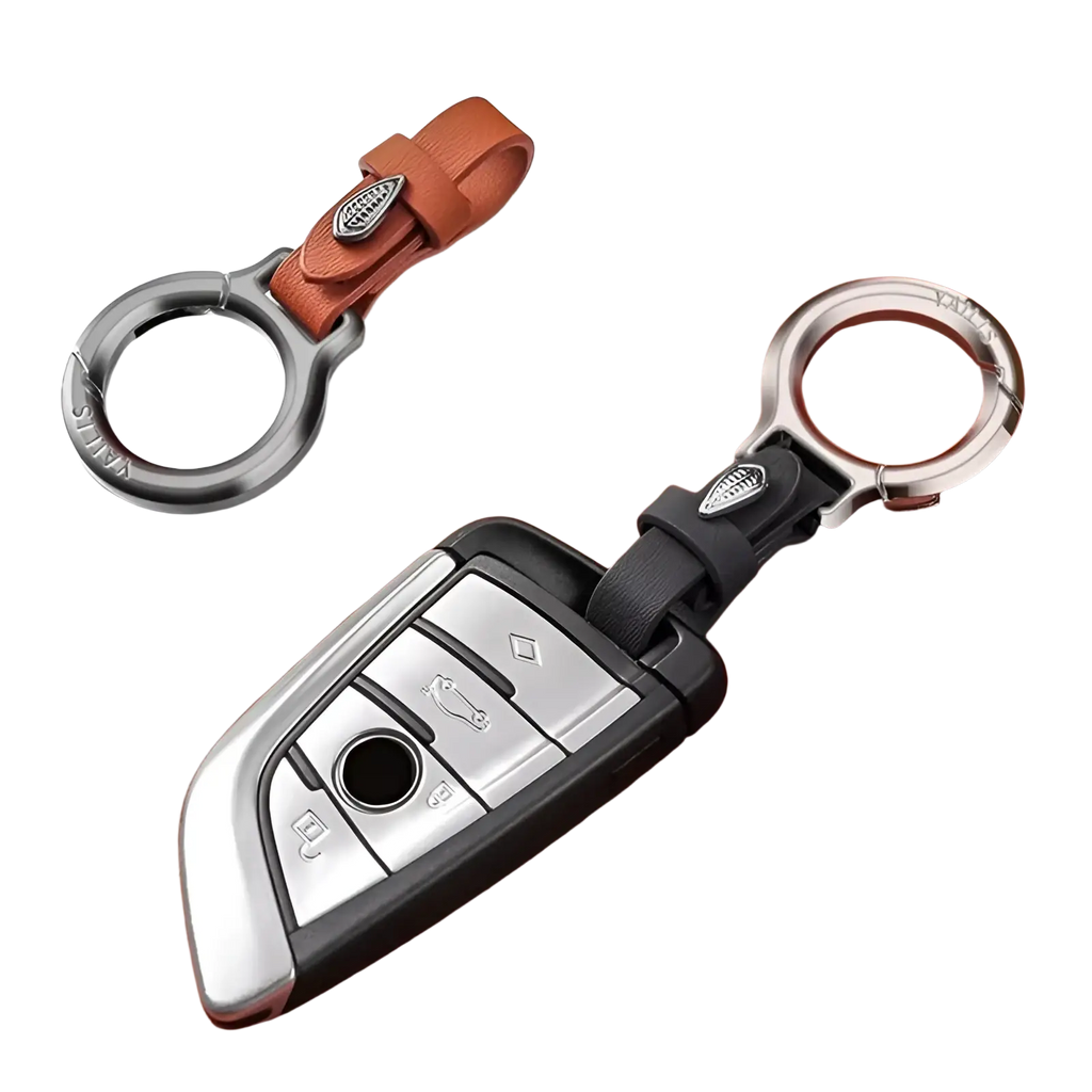 Leather car keychain with leaf charm featuring a silver and black car key fob cover with leather strap and metal ring