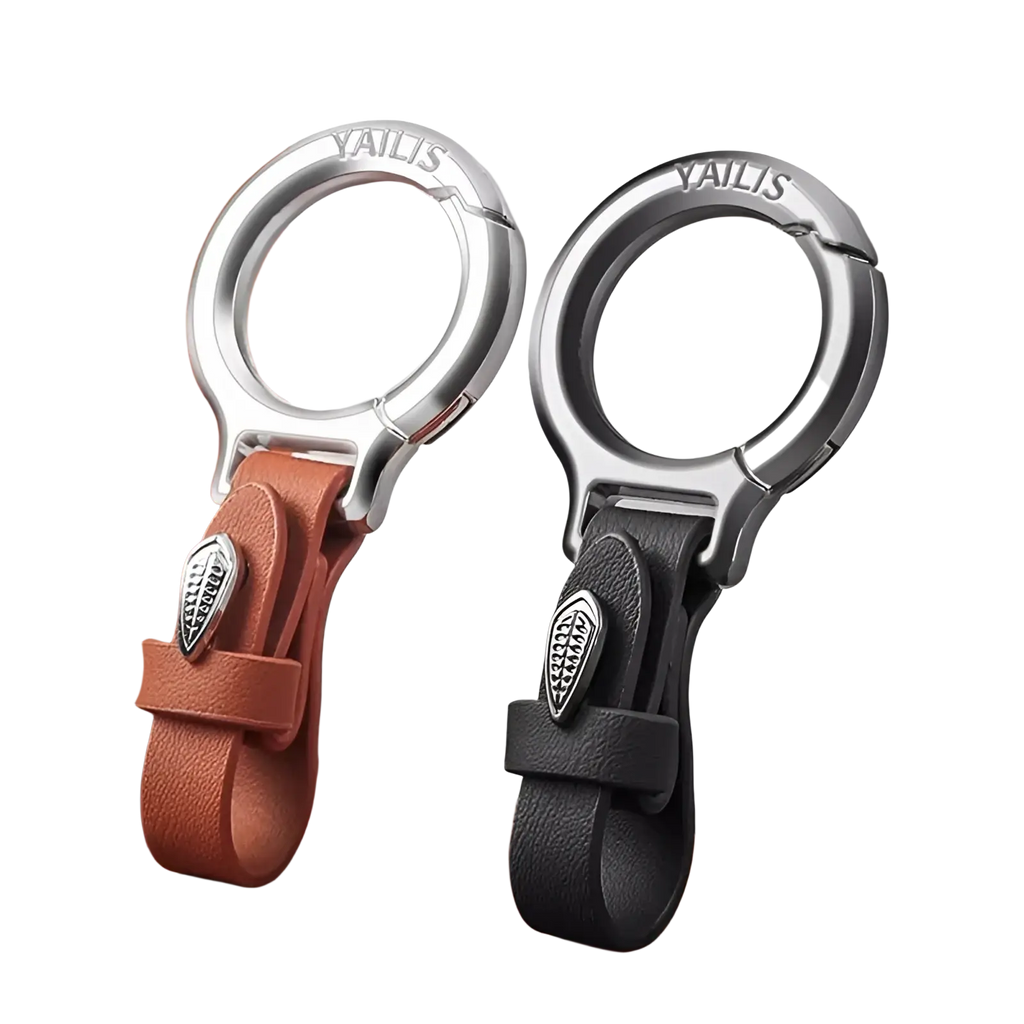 Two yailis leather car keychains with tan and black straps silver metal clasps and leaf-shaped charms