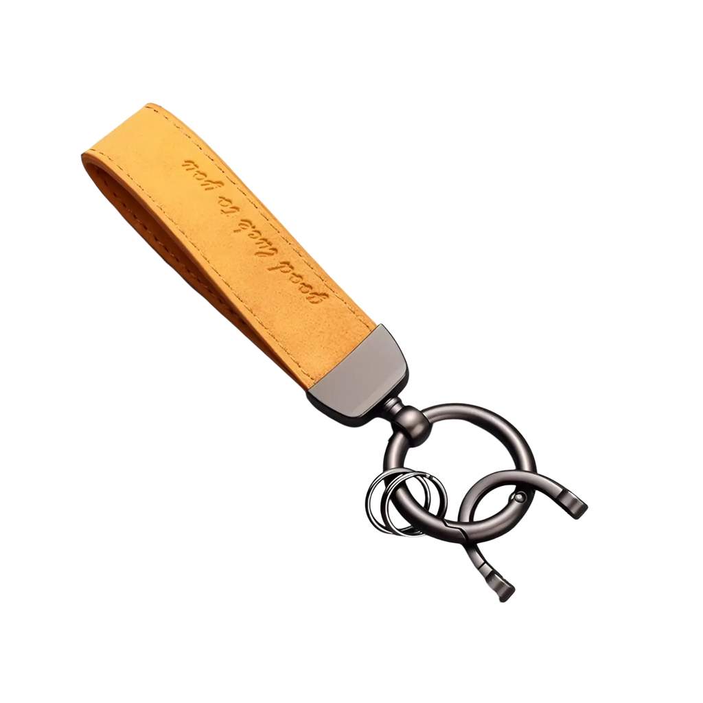 A tan leather car keychain with zinc alloy clasp and ring engraved with good luck to you luxury genuine leather key ring