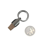 Silver usb flash drive with matte metallic finish and brown leatherette cap attached to leather car keychain metal holder