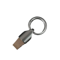 Silver usb flash drive with matte metallic finish and brown leatherette cap attached to leather car keychain metal holder