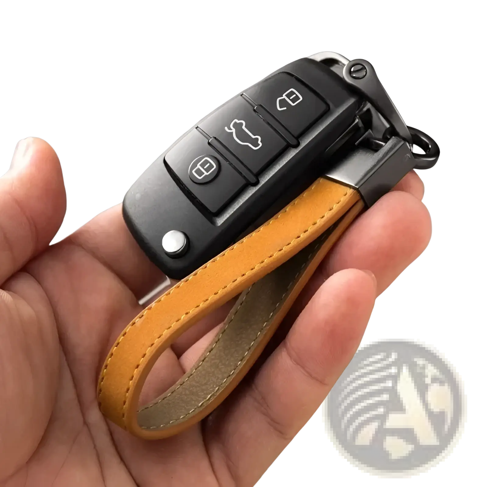 Black audi key fob attached to a tan leather strap of a minimalist leather car keychain key ring