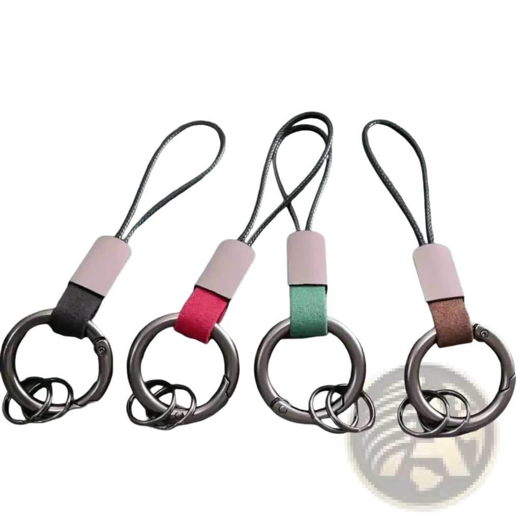 Four leather-wrapped carabiner keychains with metal rings in pink red green and brown multifunctional key holders