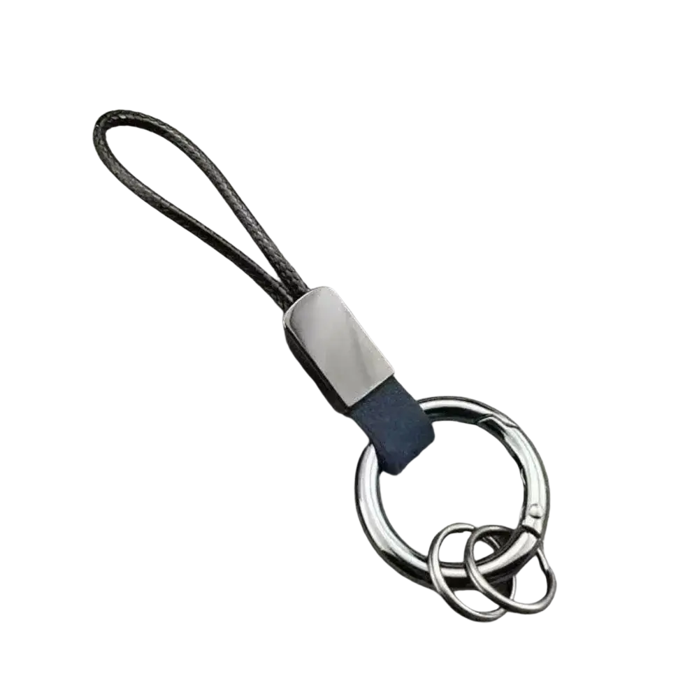 Leather Carabinieri keychain with black braided cord, sleek silver metal plate, ring, and navy blue leather accent