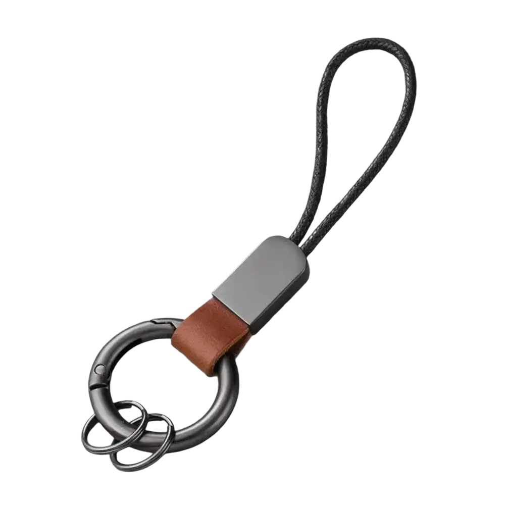 Leather Carabinieri keychain with a sleek matte metal finish, brown leather strap, and dark gray braided cord