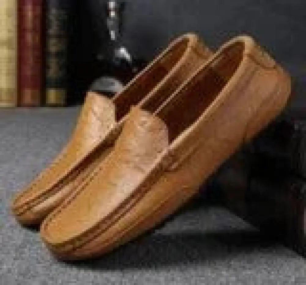 Men’s soft leather slip on loafers in tan with classic slip-on design and subtle stitching details for casual wear