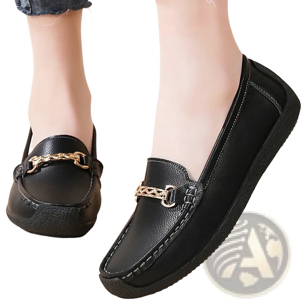 Black leather leather chain loafers low heel flats featuring a gold chain-link buckle detail on the front