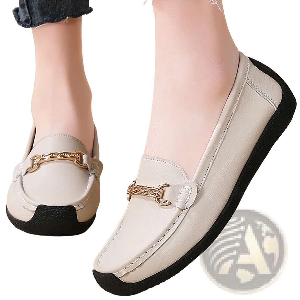 Cream-colored leather chain loafers low heel flats with gold-tone buckle and black rubber soles